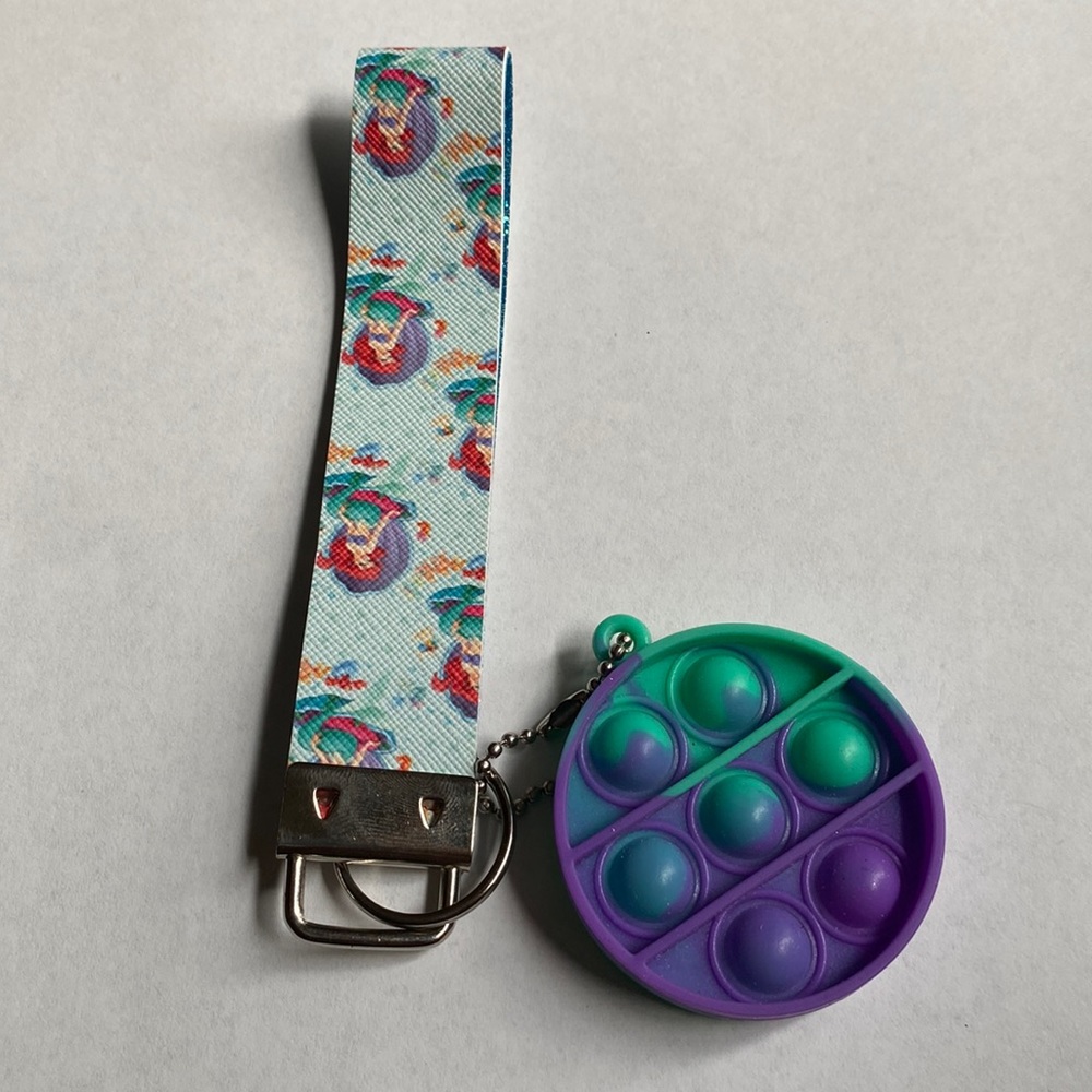 Ariel from my little mermaid wristlet with blue glitter inside